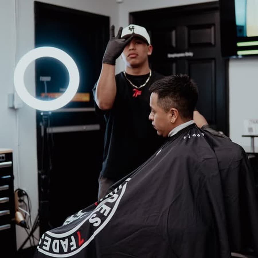Fresh fade and lineup on a client inside the shop during the meet