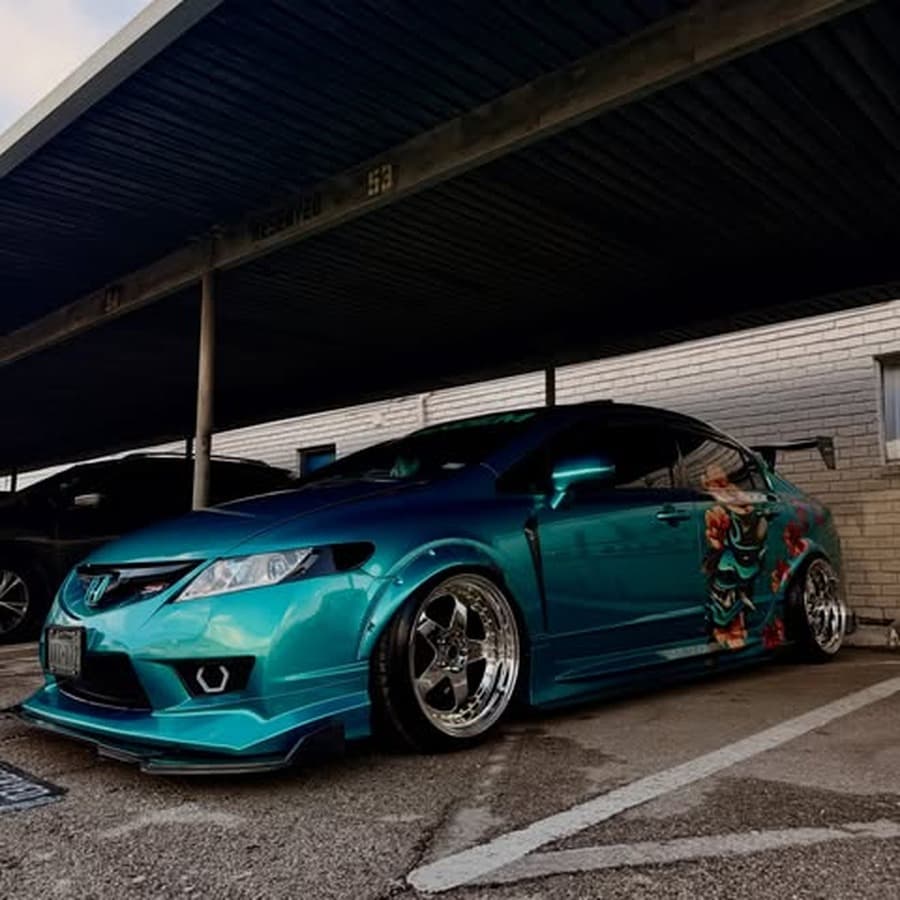 Teal widebody Pandem Civic build parked at the 7Fades car meet